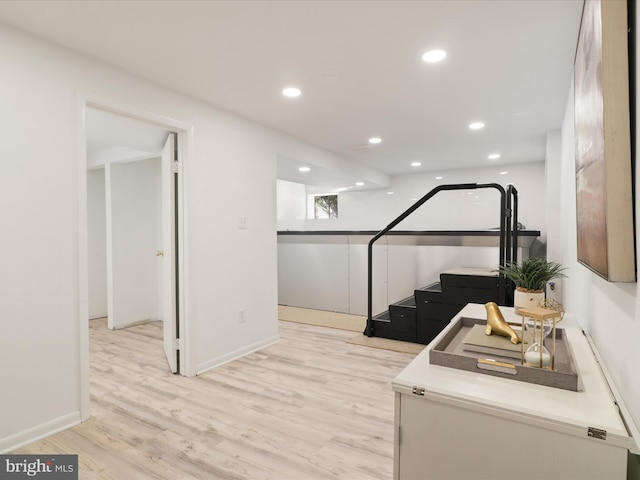 workout room with light wood-type flooring