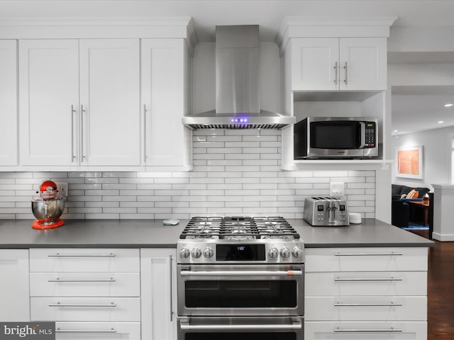 6230 21st St N, Arlington, VA 22205 - kitchen with wall chimney range hood, appliances with stainless steel finishes, white cabinetry, backsplash, and recessed lighting