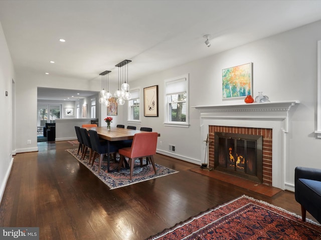 6230 21st St N, Arlington, VA 22205 - dining space featuring wood finished floors, a fireplace, baseboards, recessed lighting, and a chandelier