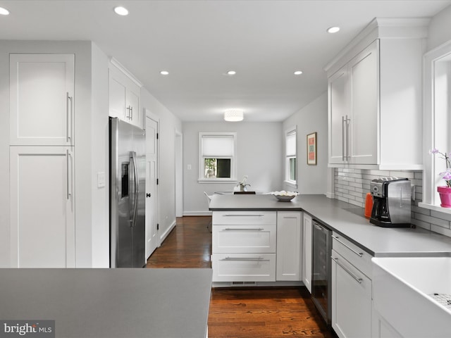 6230 21st St N, Arlington, VA 22205 - kitchen featuring stainless steel fridge, a peninsula, recessed lighting, beverage cooler, and white cabinetry