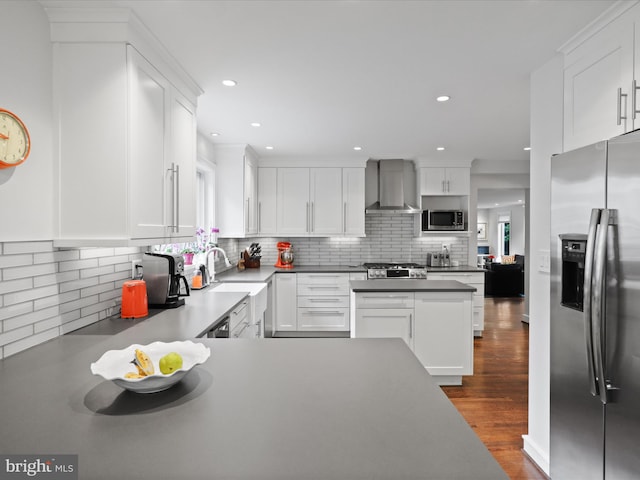 6230 21st St N, Arlington, VA 22205 - kitchen with appliances with stainless steel finishes, wall chimney range hood, backsplash, white cabinets, and recessed lighting