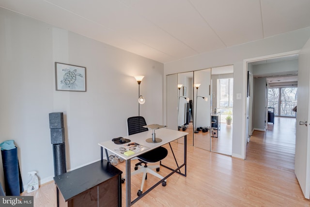 office area with light hardwood / wood-style flooring