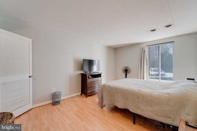 bedroom with light wood-type flooring