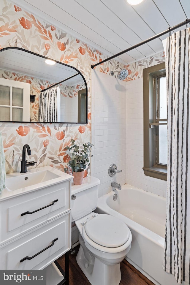 full bathroom featuring shower / bathtub combination with curtain, vanity, and toilet