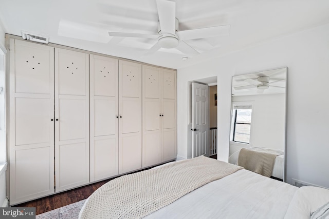 bedroom featuring ceiling fan and dark hardwood / wood-style flooring