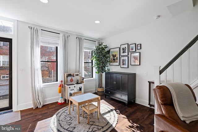 office with dark hardwood / wood-style floors