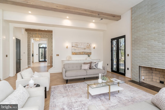 living area with beamed ceiling, recessed lighting, a fireplace, and baseboards