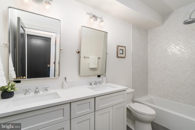 bathroom with double vanity, toilet, shower / bathtub combination, and a sink