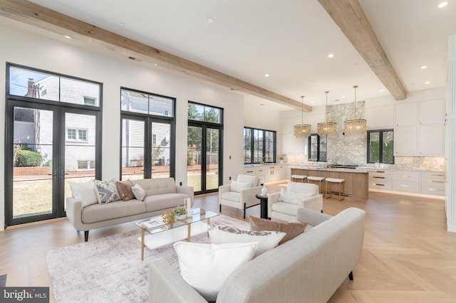 living room featuring beam ceiling, recessed lighting, and french doors