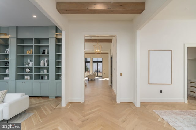 hall with recessed lighting, baseboards, beam ceiling, and a chandelier