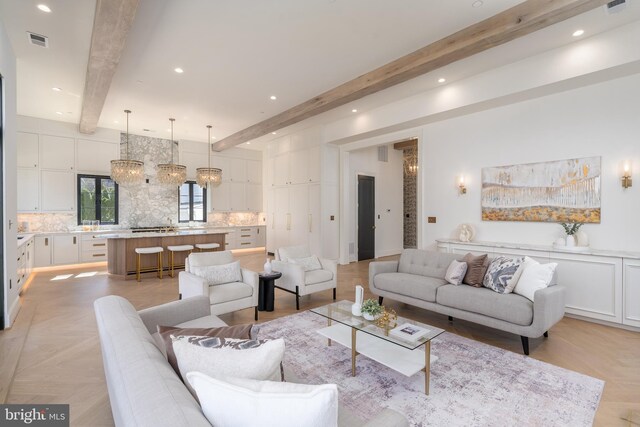 living area with recessed lighting, visible vents, and beam ceiling