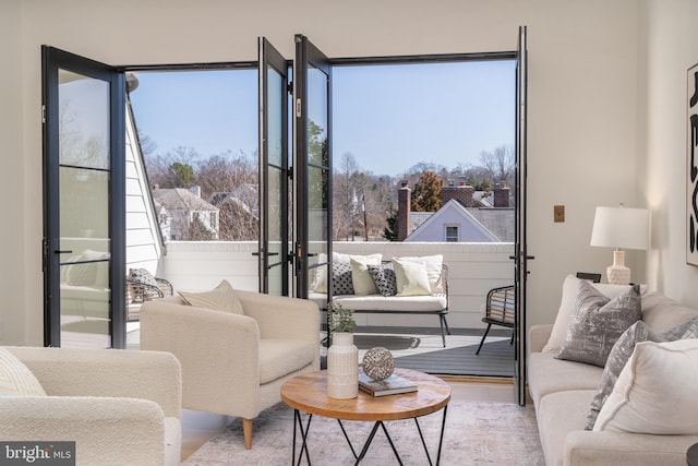 living area featuring plenty of natural light and wood finished floors