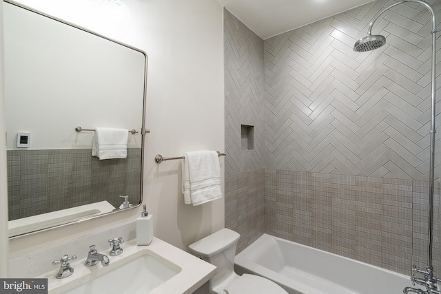 full bath with vanity, toilet, and shower / bath combination