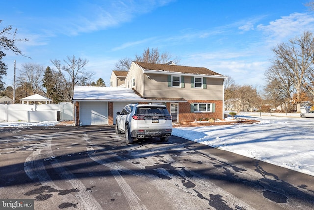 front of property with a garage