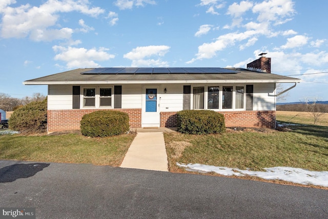 view of front of home with covered porch and a front yard