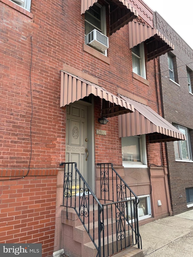 property entrance with cooling unit