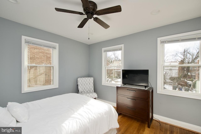 bedroom featuring ceiling fan and light hardwood / wood-style flooring