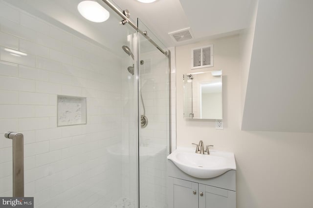 bathroom featuring vanity and walk in shower