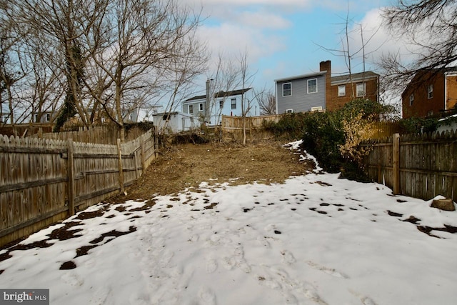 view of yard covered in snow