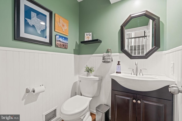 bathroom with vanity and toilet