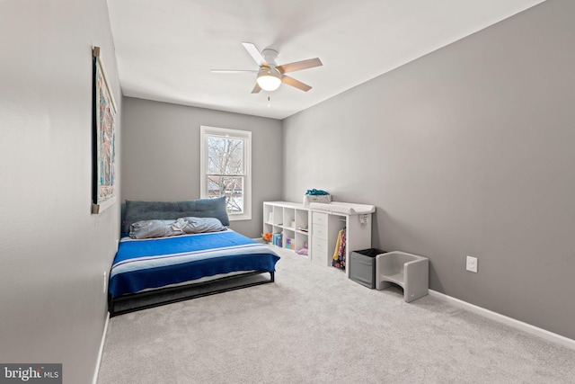 carpeted bedroom with ceiling fan