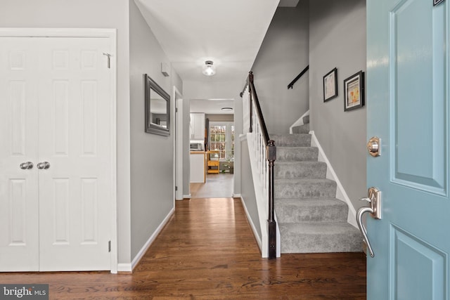 entrance foyer with dark hardwood / wood-style floors