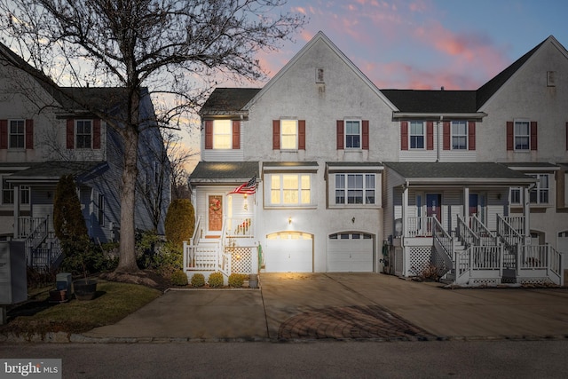 view of front of home with covered porch and a garage