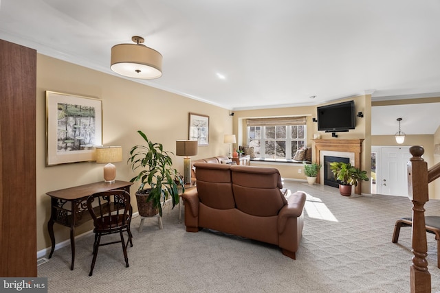 carpeted living room with crown molding