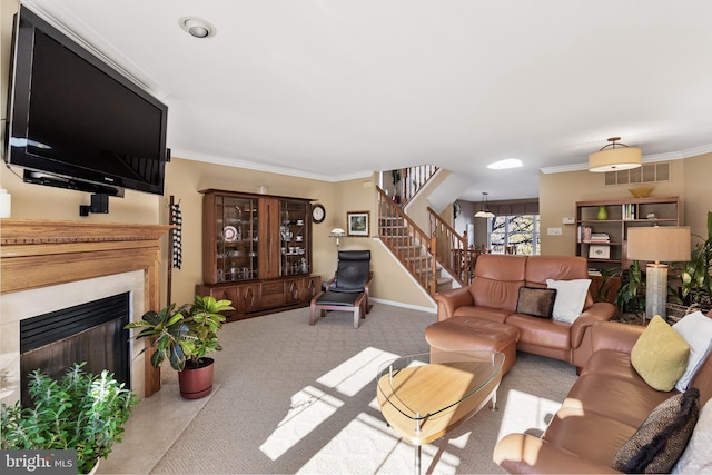 living room with ornamental molding and light carpet