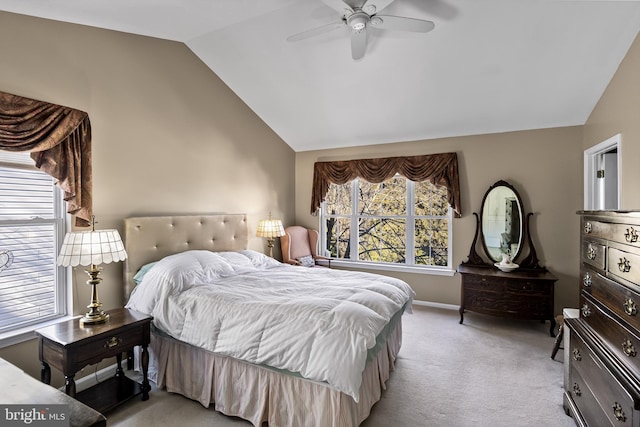 carpeted bedroom featuring ceiling fan and lofted ceiling