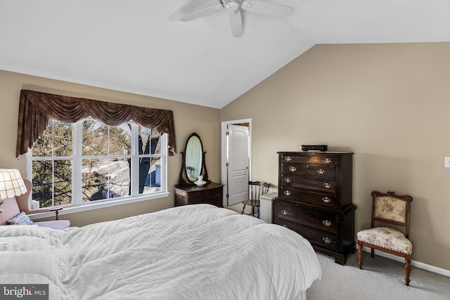 carpeted bedroom with ceiling fan and lofted ceiling