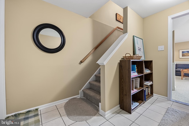 stairway featuring tile patterned floors