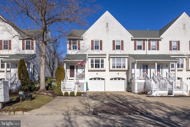 view of front of house featuring a porch and a garage