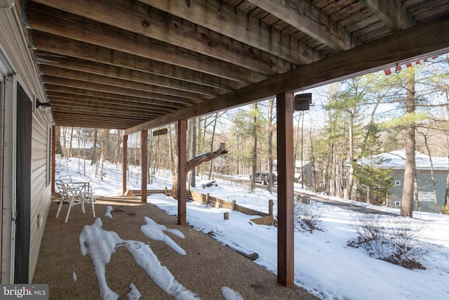 view of snow covered patio