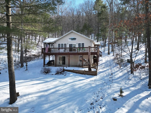 view of front facade with a wooden deck