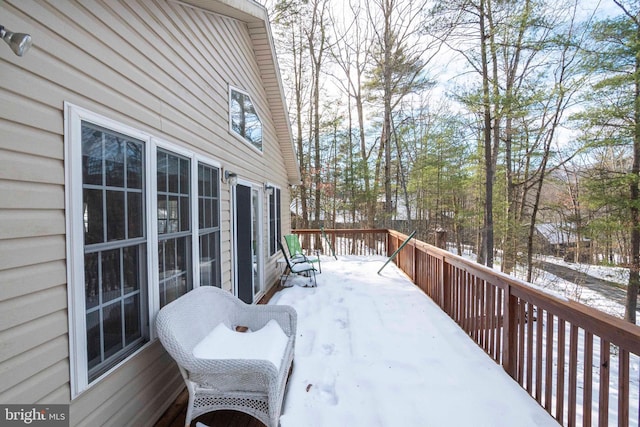 view of snow covered deck