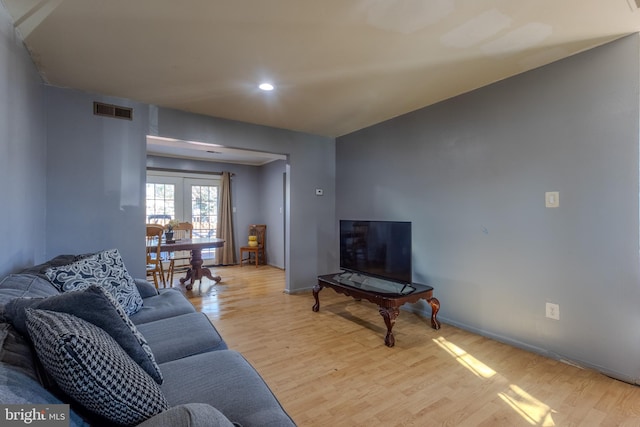 living room with light hardwood / wood-style flooring