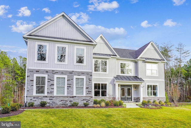 view of front of home with french doors and a front lawn