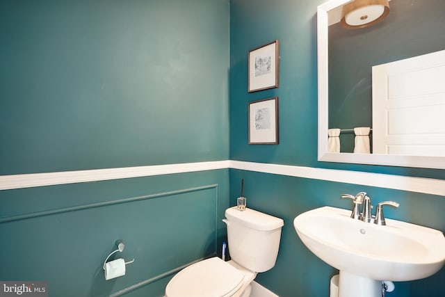 bathroom with sink and toilet