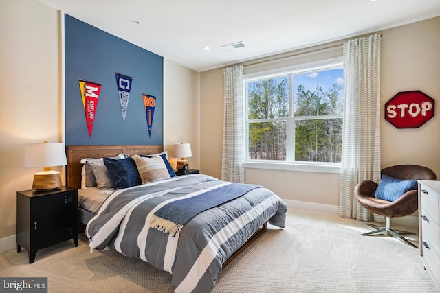 bedroom with light colored carpet