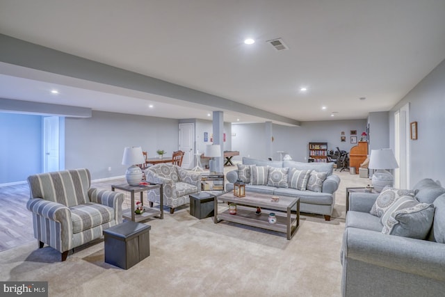 living room featuring light carpet