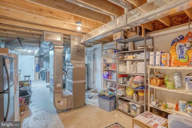 basement featuring stainless steel fridge