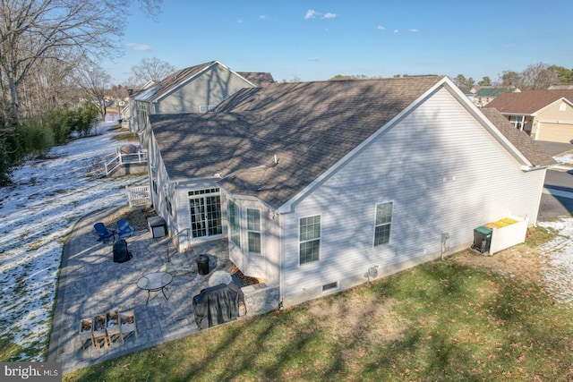 back of house featuring a patio and a yard