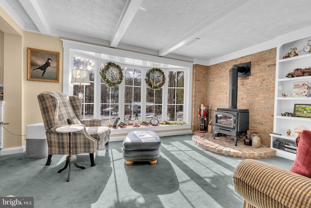 interior space with carpet floors, beamed ceiling, and a wealth of natural light