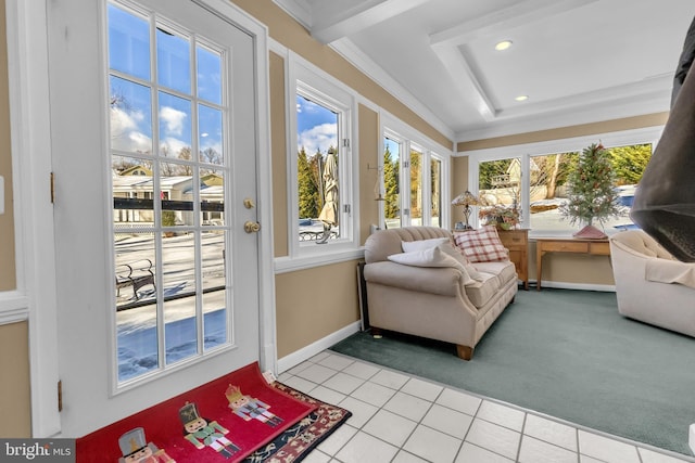 sunroom / solarium with a healthy amount of sunlight and a raised ceiling