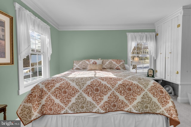 bedroom featuring carpet flooring, ornamental molding, and multiple windows