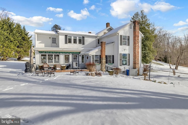 view of snow covered house