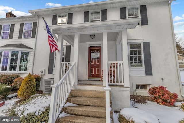 view of snow covered property entrance