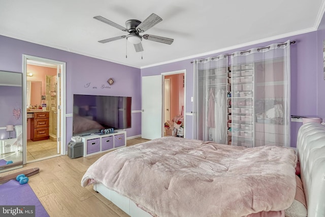 bedroom with ensuite bath, ceiling fan, hardwood / wood-style flooring, and crown molding