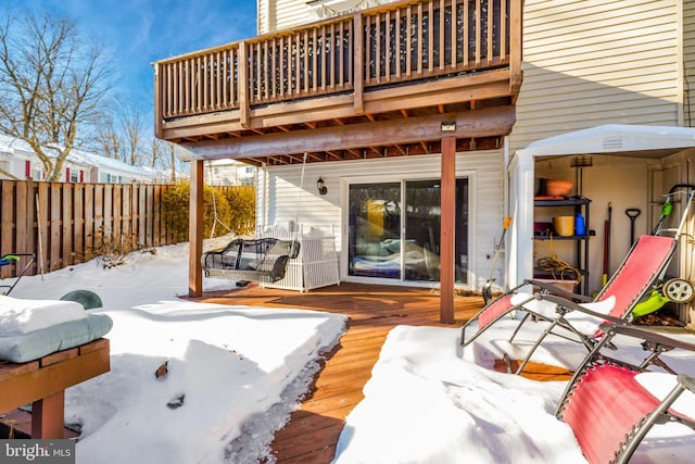 view of snow covered deck